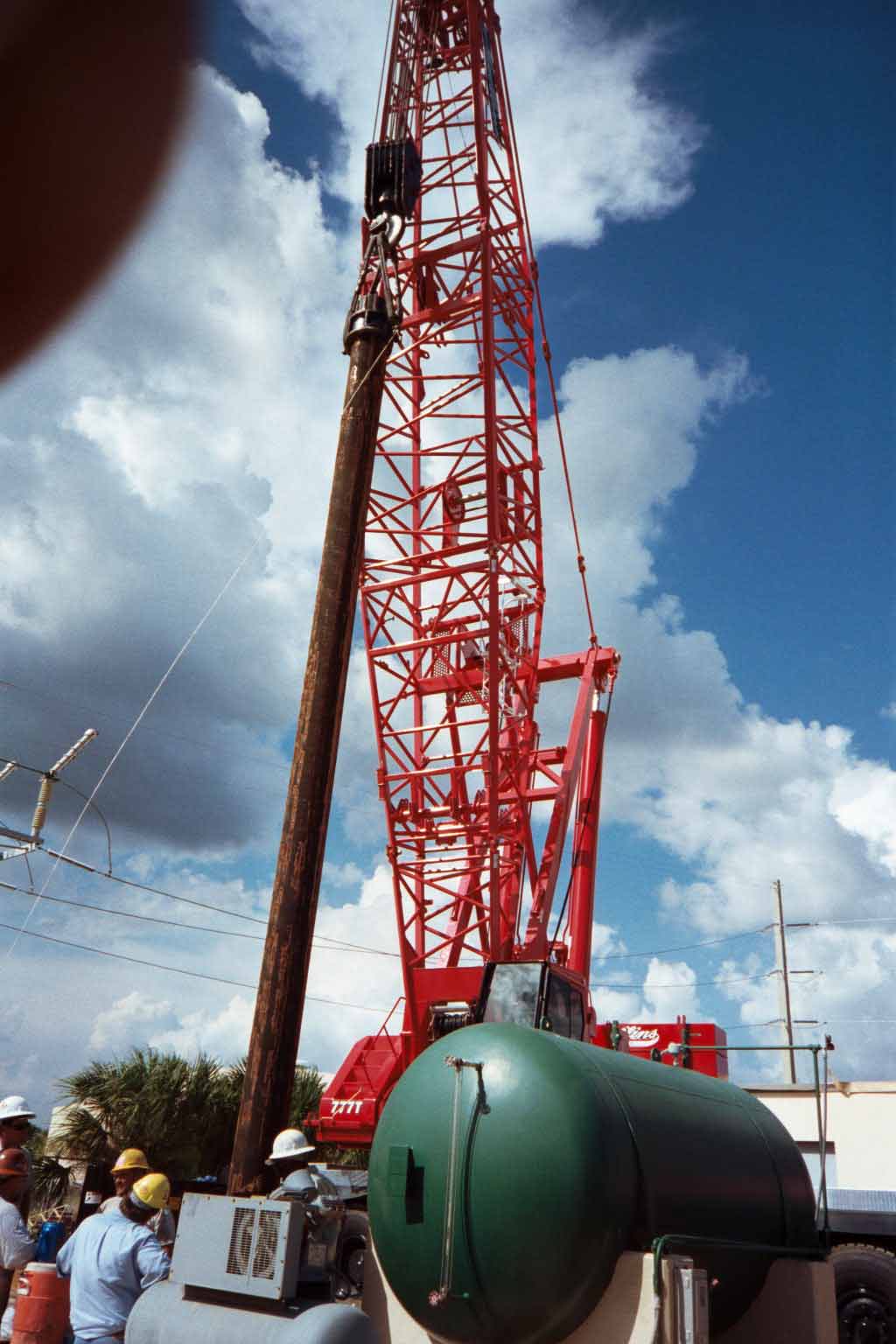 Field installation crew setting industrial piping